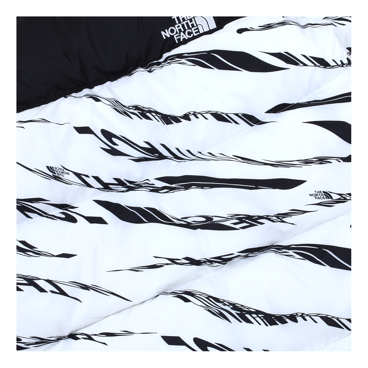 The North Face Zebra-Pattern Puffer Jacket — #452